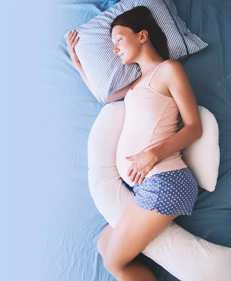 Pregnant women Sleep on her side using C shaped Pillows
